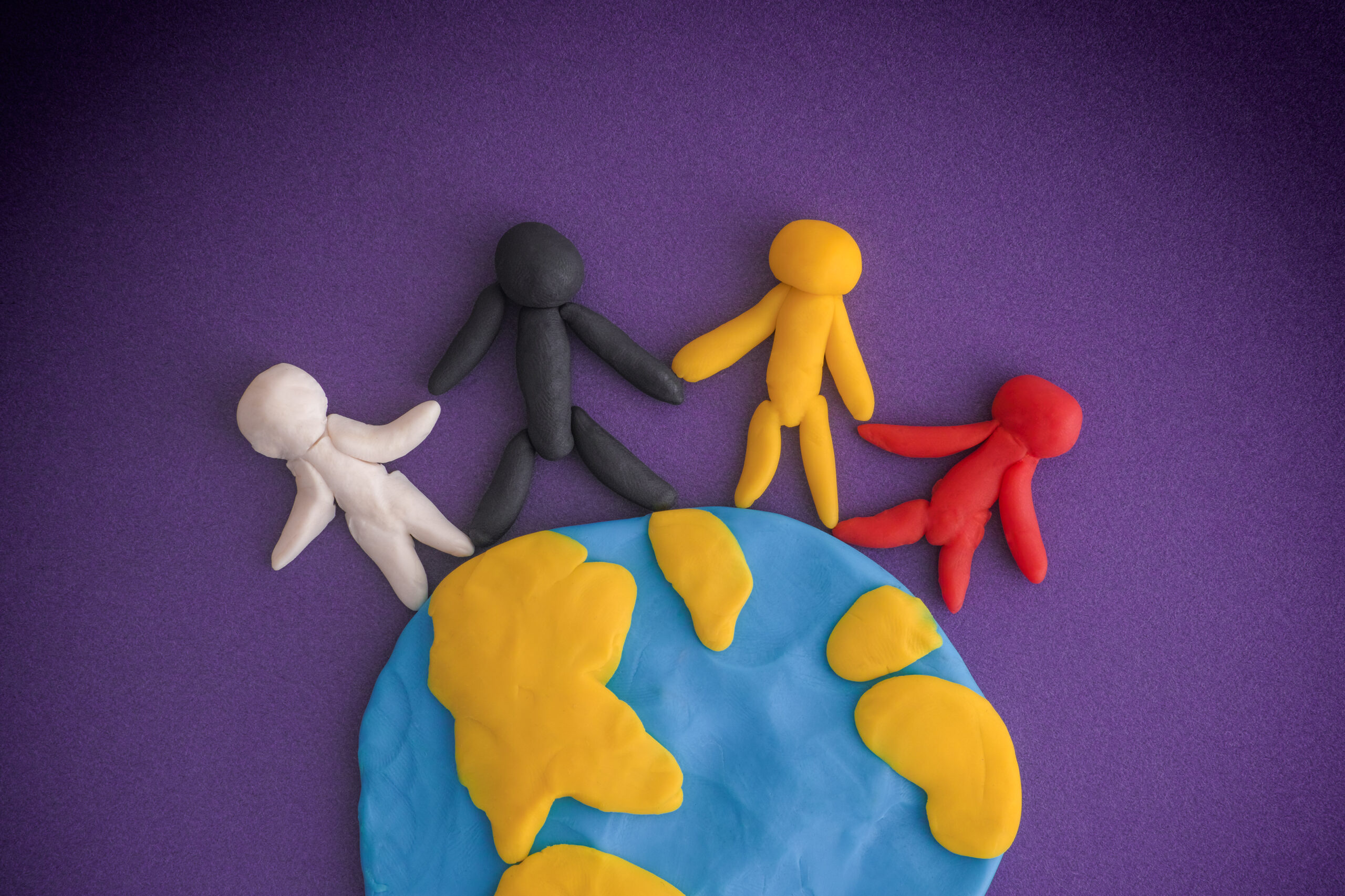 Group of people around the world made out of Play-Doh